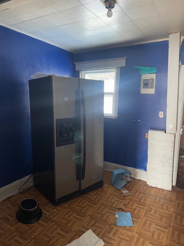 kitchen with dark parquet flooring and stainless steel fridge with ice dispenser