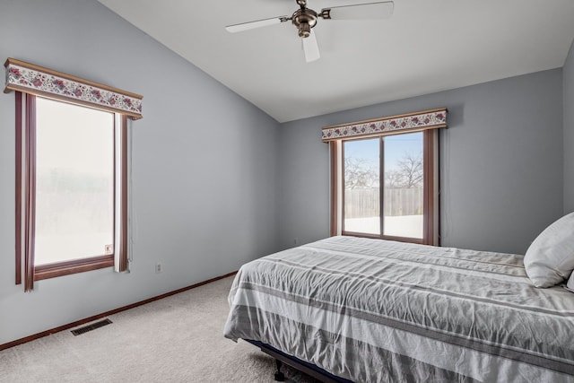 bedroom featuring vaulted ceiling, ceiling fan, and carpet flooring