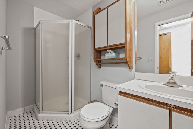 bathroom featuring vanity, walk in shower, and toilet