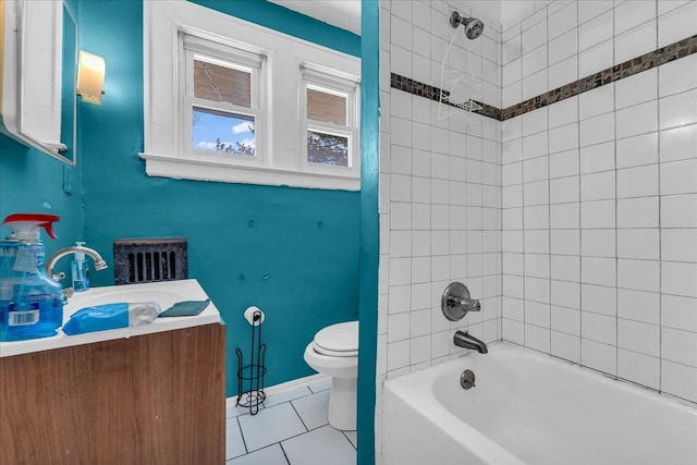 full bathroom with toilet, tiled shower / bath combo, tile patterned floors, and vanity