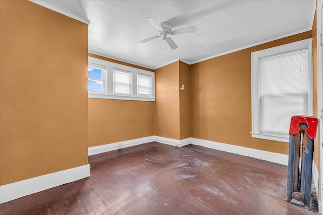 spare room with ceiling fan, hardwood / wood-style flooring, and crown molding