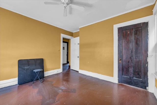 unfurnished room with ceiling fan and ornamental molding