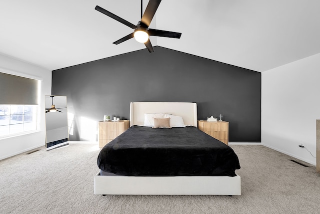 bedroom featuring vaulted ceiling with beams, ceiling fan, and carpet floors