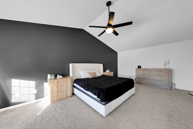 carpeted bedroom with ceiling fan and vaulted ceiling