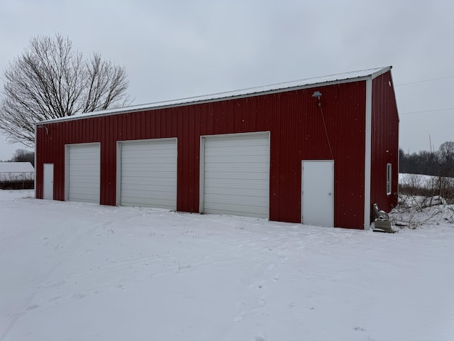 view of snow covered garage