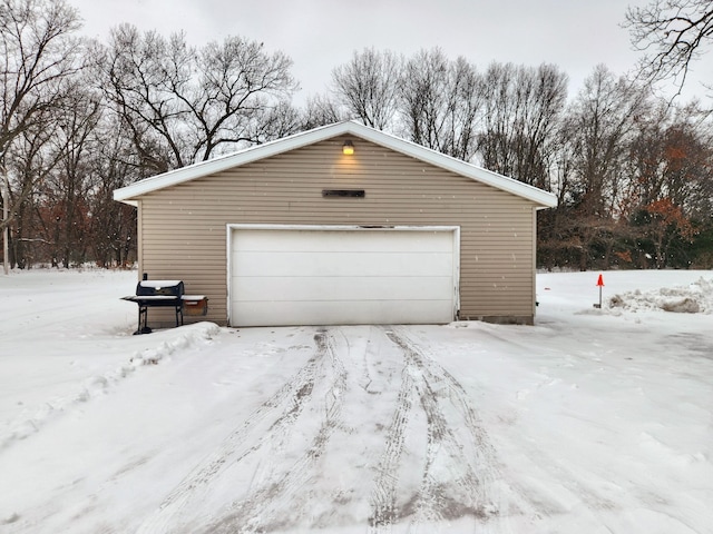 view of snow covered garage