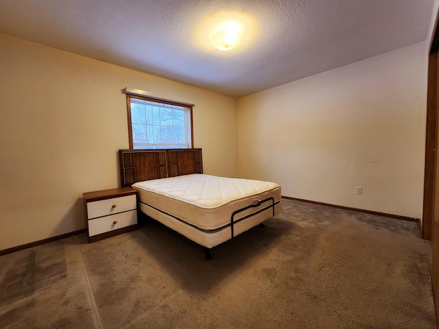 carpeted bedroom with a textured ceiling