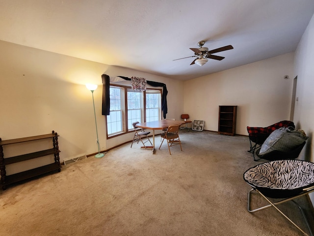 dining area featuring carpet flooring and ceiling fan