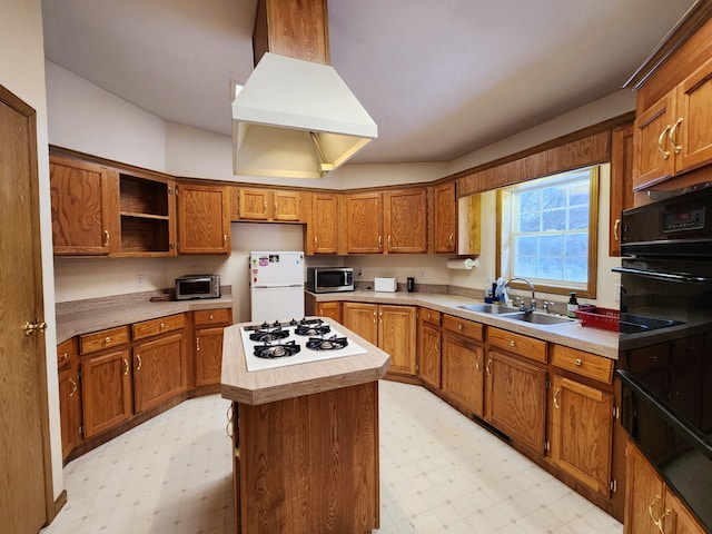 kitchen with white appliances, a kitchen island, and sink