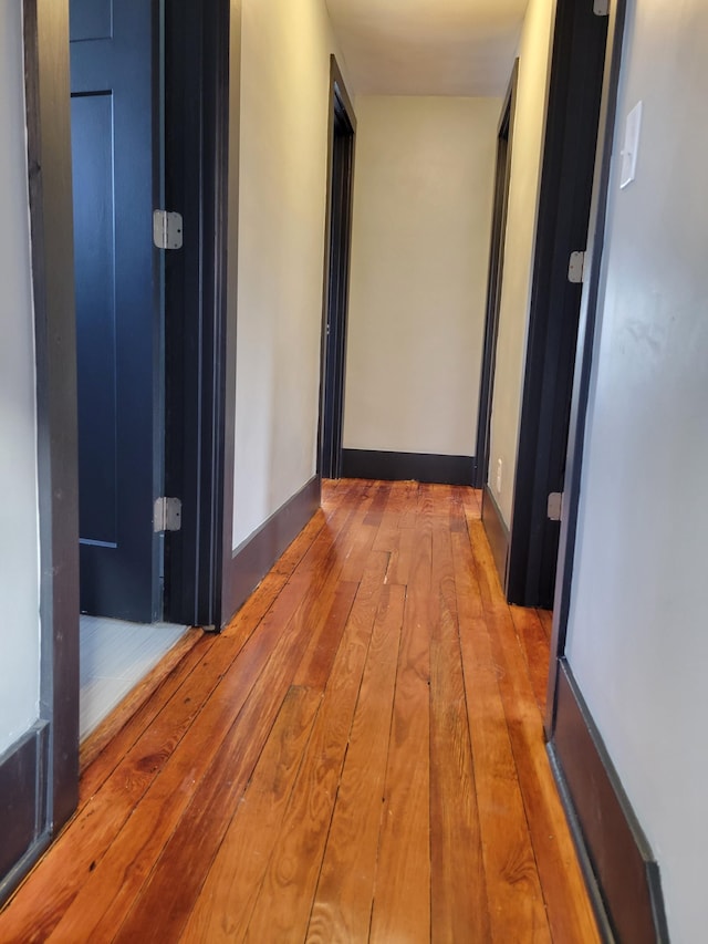 hall with light hardwood / wood-style floors