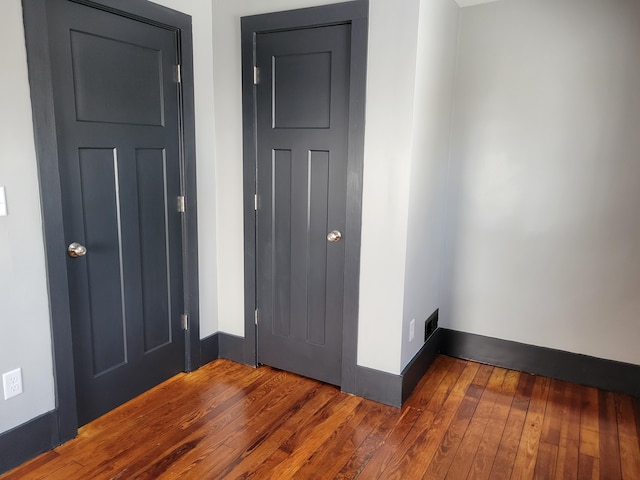 entrance foyer with dark hardwood / wood-style flooring