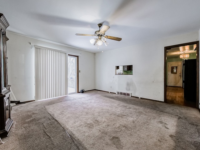 unfurnished living room featuring ceiling fan and carpet floors