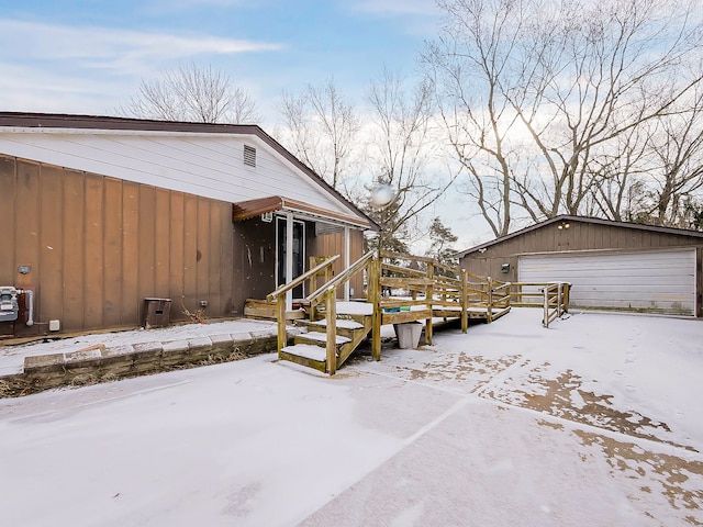 exterior space featuring a garage and an outdoor structure