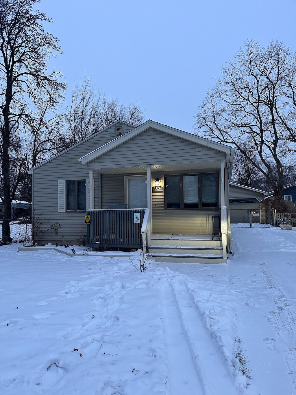 view of front of house featuring covered porch and a garage