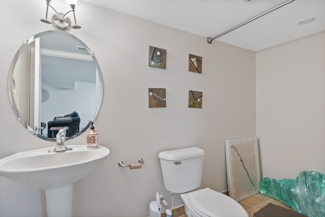 bathroom featuring toilet and tile patterned floors