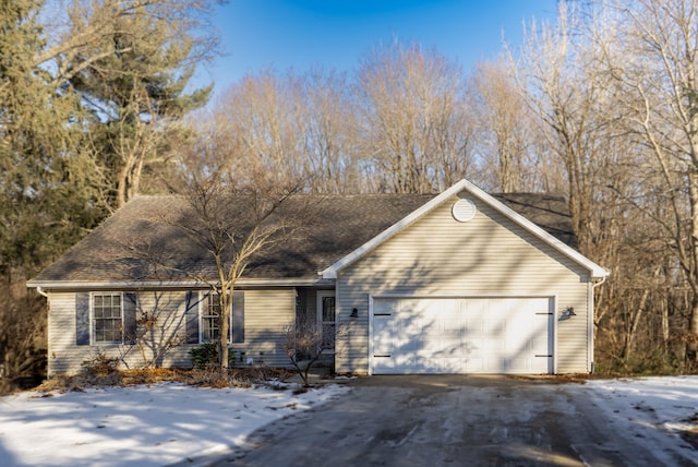 single story home with a garage