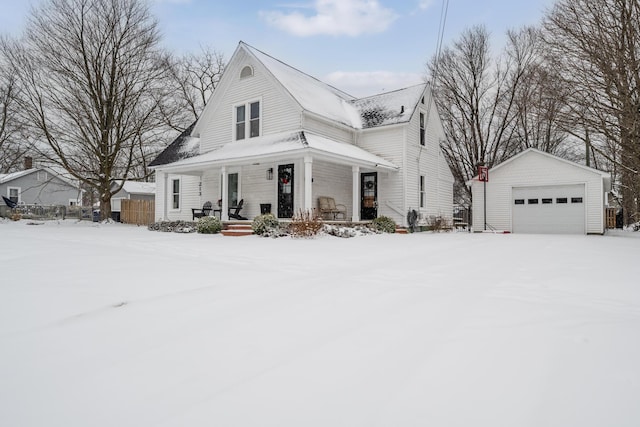 view of front facade with a porch, a garage, and an outdoor structure