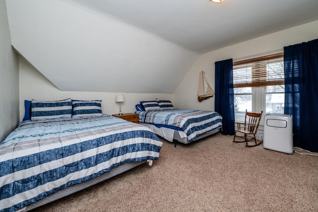 bedroom featuring carpet flooring and vaulted ceiling