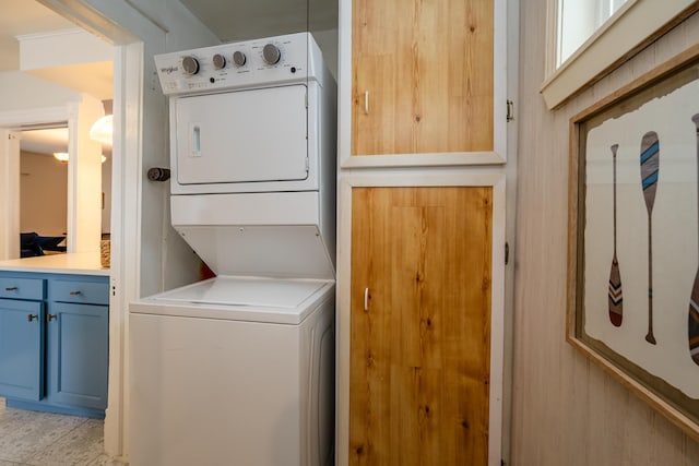 laundry area featuring stacked washing maching and dryer