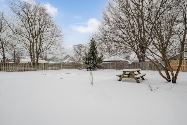 view of yard covered in snow