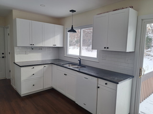 kitchen featuring white dishwasher, white cabinets, dark hardwood / wood-style floors, and sink