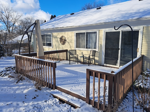 view of snow covered deck