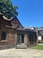 back of property featuring a patio