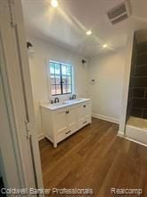 bathroom with sink and hardwood / wood-style floors