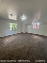 empty room with lofted ceiling