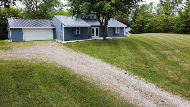 single story home with a front lawn and a garage