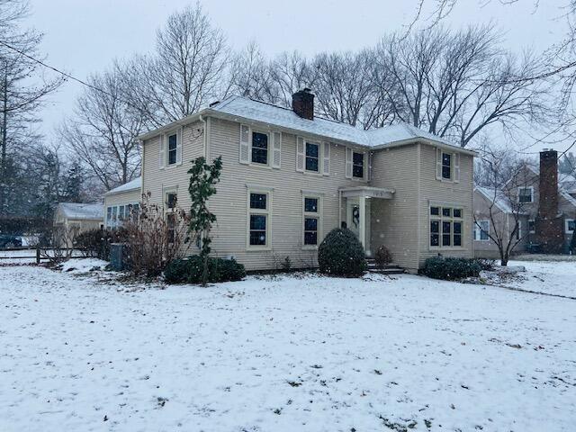 view of snow covered house