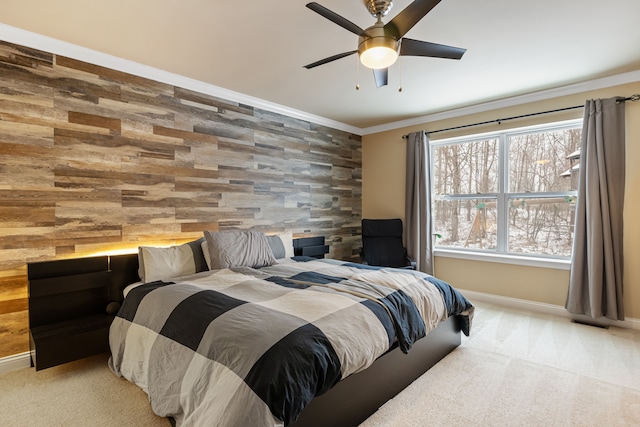 carpeted bedroom with ceiling fan and crown molding