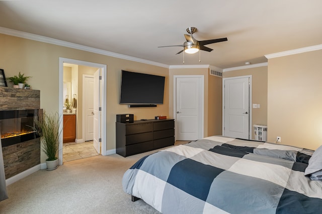 carpeted bedroom featuring ensuite bathroom, ceiling fan, radiator, crown molding, and a stone fireplace