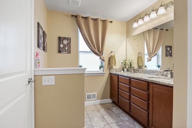 bathroom with vanity and tile patterned flooring