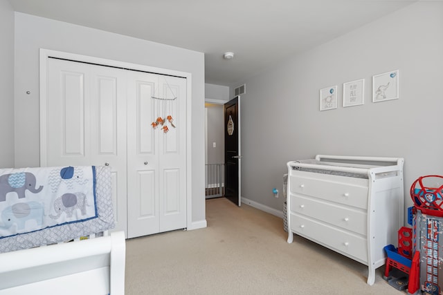 carpeted bedroom featuring a closet