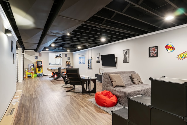 recreation room with wood-type flooring