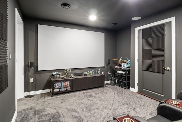 cinema room featuring carpet floors