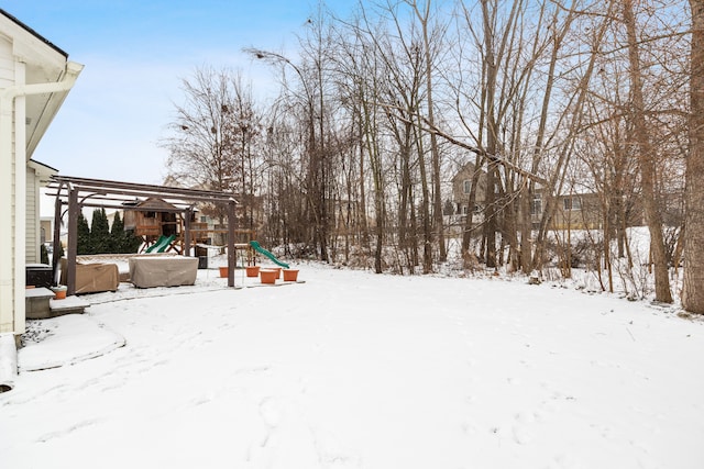 snowy yard with a playground