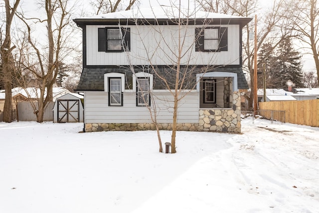 view of front of property featuring a storage unit