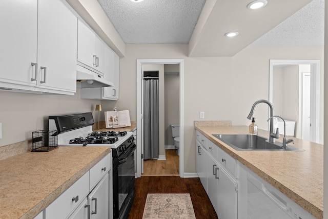 kitchen featuring dark hardwood / wood-style floors, sink, white cabinetry, a textured ceiling, and range with gas stovetop