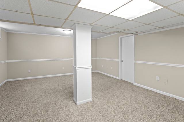 basement with carpet floors and a paneled ceiling