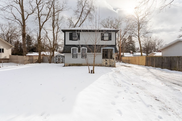 view of front of house with a storage shed