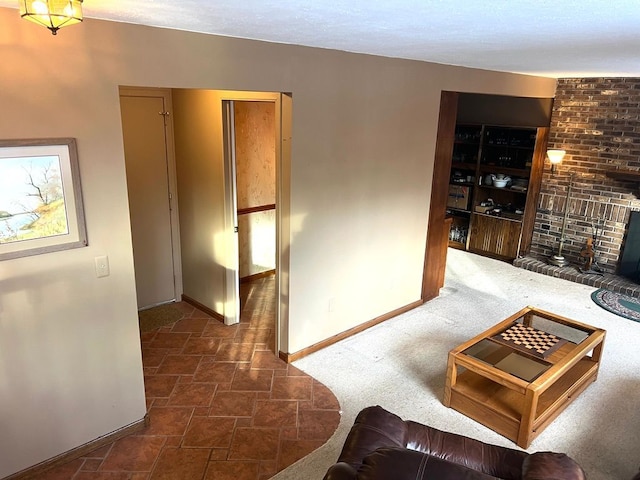 living room featuring a brick fireplace