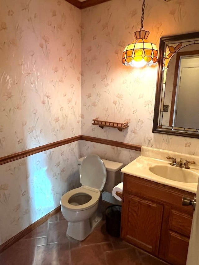 bathroom featuring toilet and vanity