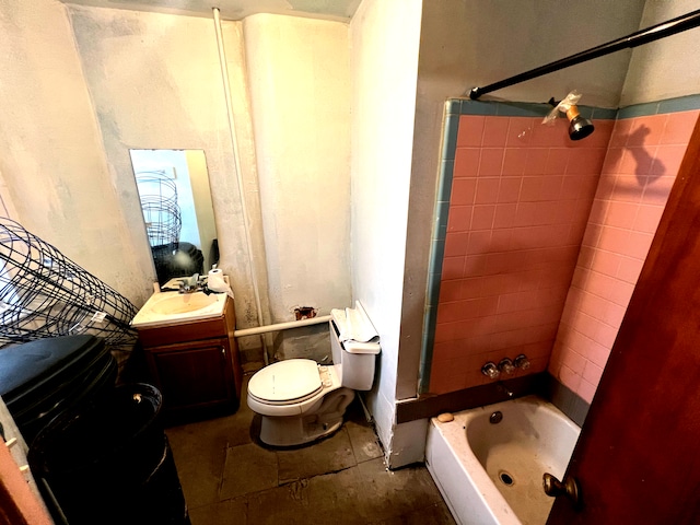 full bathroom with toilet, vanity, and tiled shower / bath