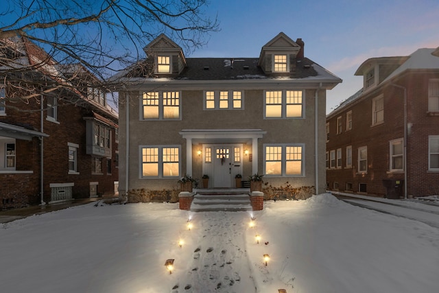 view of snow covered house