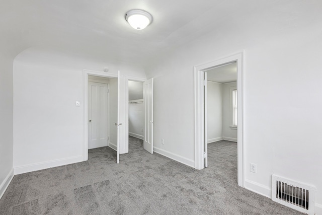 unfurnished bedroom with light carpet