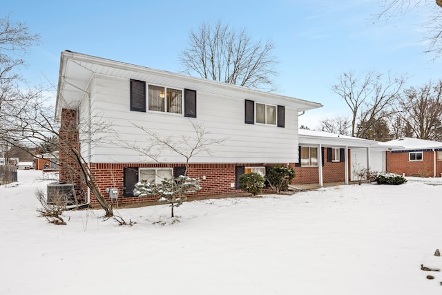 split level home featuring cooling unit