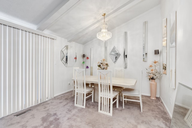 carpeted dining area with an inviting chandelier and lofted ceiling with beams