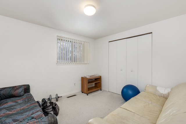 living room featuring light carpet